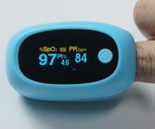 The talking pulse oximeter is blue and has a large LED screen that displays your heart beat and oxygen levels. The person has oxygen levels at 97% and 84 beats per minute. They need medical assistance pronto!