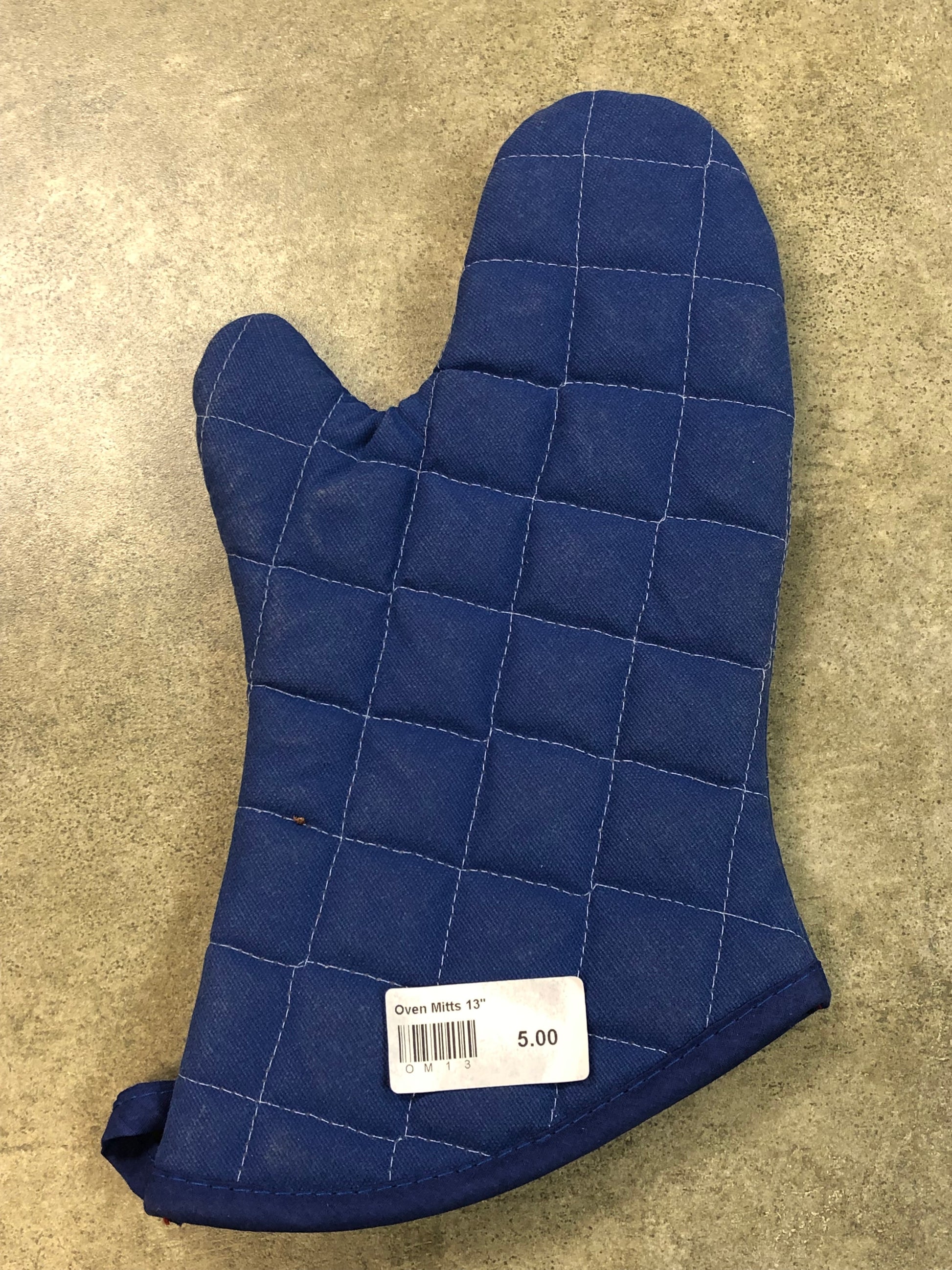 A blue oven mitt with white stitching. Looks kind of like Michigan
