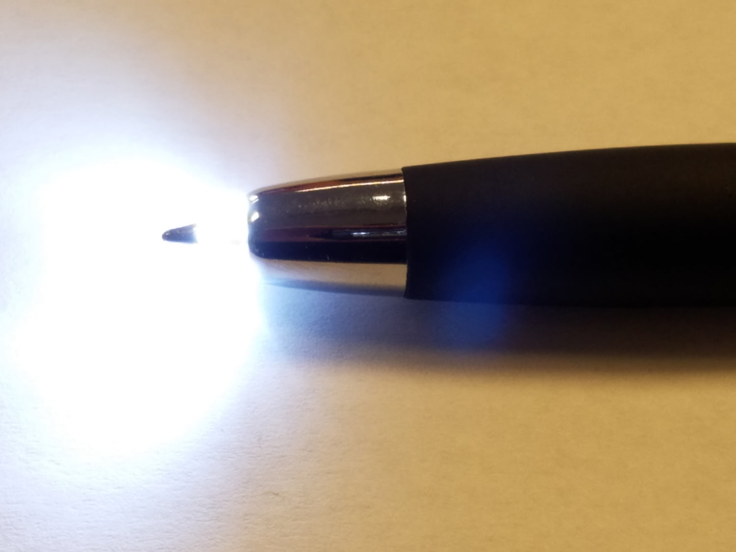 A close up of the pen tip with the light on