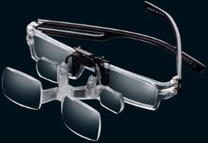 A Pair of Max Detail Clip Ons attached to frame of glasses